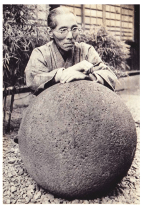 Kanjiro Kawai in his garden with his favourite Round Stone